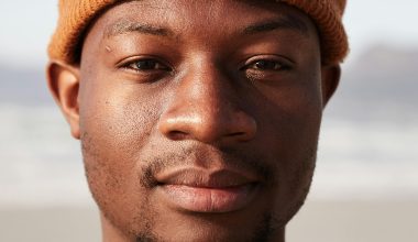 man with beanie staring into camera